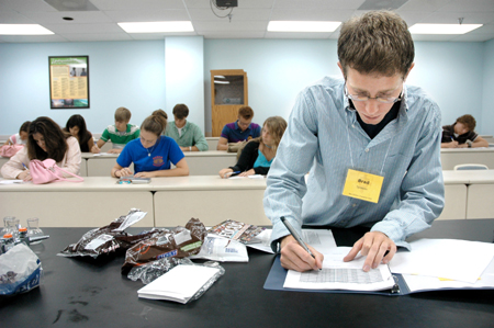 Brad Spencer takes roll with his Focus group during New Student Orientation. - Photo by Kristen Nicole Sayres
