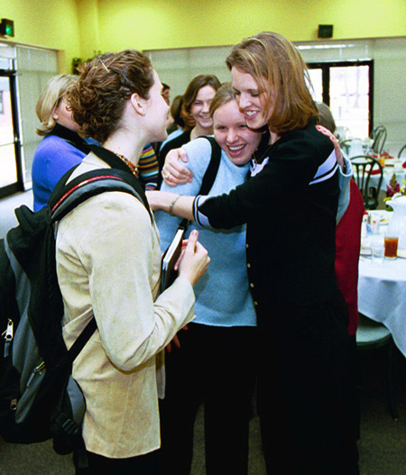 Heather Mercer gives Social Work major Meghan Daily a hug after the luncheon following the chapel service. - Photo by Jim Veneman