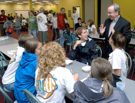 President Dockery fellowships with Brad Spencer and a group of freshmen at the Ice Cream Social during New Student Orientation. - Photo by Brad Moore