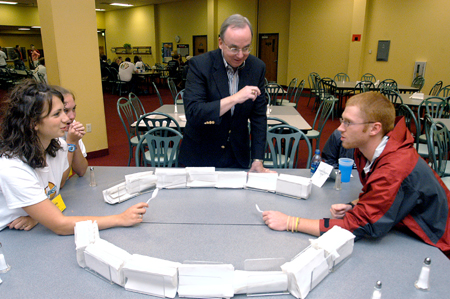 President Dockery officiates an intense game of spoon hockey between Lydia Livingston & Luke Pruett during the Ice Cream Social at New Student Orientation. - Photo by Brad Moore
