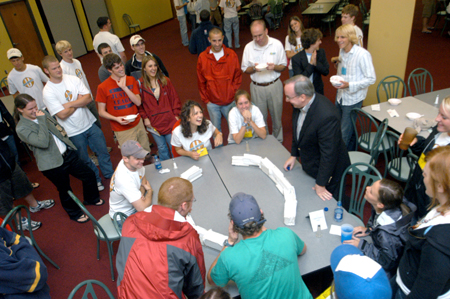 A crowd gathers as President Dockery officiates an intense game of spoon hockey during the Ice Cream Social at New Student Orientation. - Photo by Brad Moore