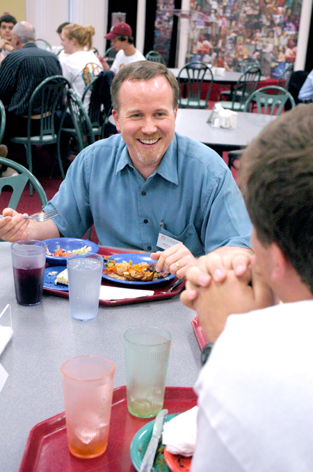 Kevin Cooney, associate professor of political science, talks with history and political science students during New Student Orientation. - Photo by Kristen Nicole Sayres