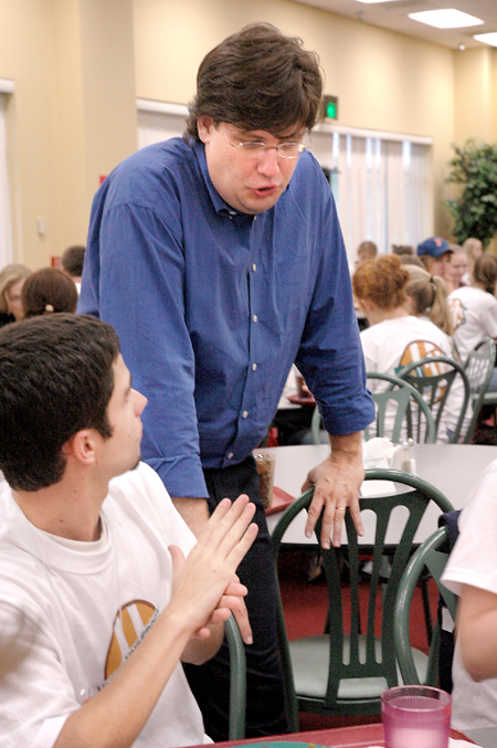 Chris Blair, associate professor of communication arts and coordinator of digital media studies, talks with Drew Rhodes during New Student Orientation. - Photo by Kristen Nicole Sayres