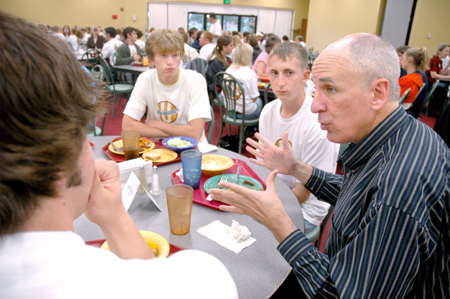 Steve Beverly, acting chair of communication arts, talks with incoming communication arts students during a New Student Orientation dinner. - Photo by Kristen Nicole Sayres