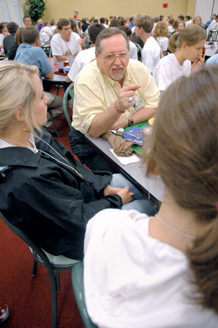 Terry Weaver, associate professor of special education, talks with incoming education students during a New Student Orientation dinner. - Photo by Kristen Nicole Sayres