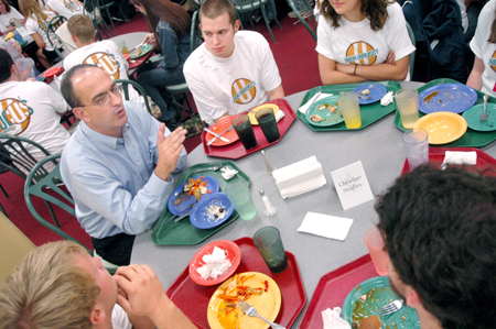 George Guthrie, Benjamin W. Perry professor of Bible, talks with incoming Christian studies students during a New Student Orientation dinner. - Photo by Kristen Nicole Sayres