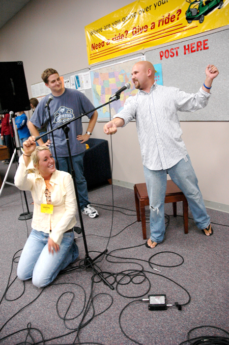 Ben Lancaster acts out a very dramatic scene from a very dramatic drama while Whitney Culver holds the mic and Tyler Whetstone watches during an open mic event in the student lounge. - Photo by Kristen Nicole Sayres