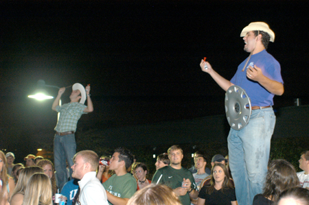 UBuzz hosts Kyle Raines and Pepper Sidhom send out a big howdy at the annual Howdy Party. - Photo by Brad Moore