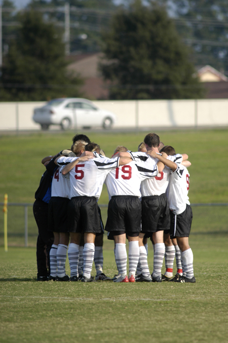 The Bulldogs huddle during the game versus Trevecca Nazarene University (Tenn.). - Photo by Kathleen Murray