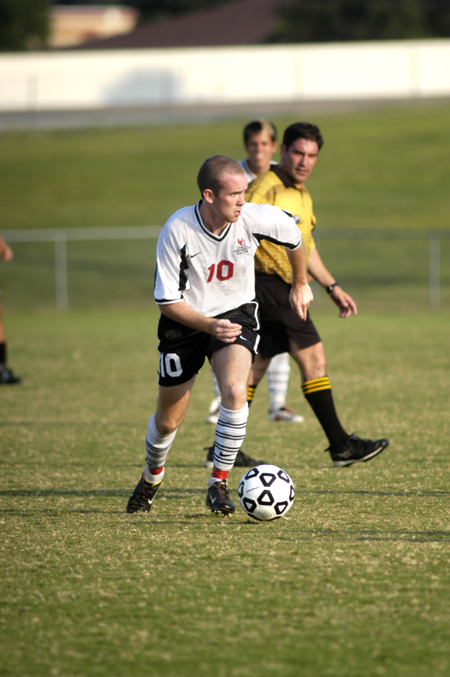 Sophmore midfielder Benny Crozier dribbles the ball upfield during Union's matchup against the Trojans of Trevecca Nazarene University (Tenn.). - Photo by Kathleen Murray