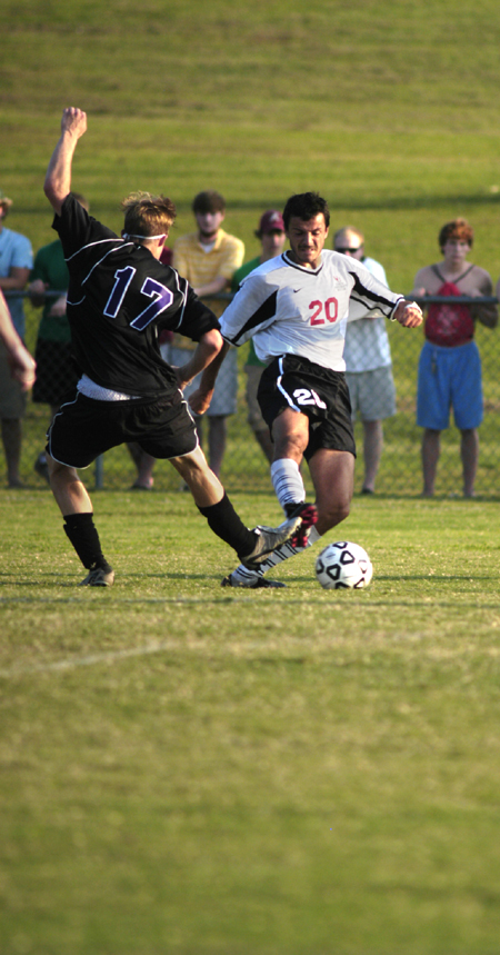 Bulldog defender Marko Pavlovic (20) tries to gain control of the ball. - Photo by Kathleen Murray