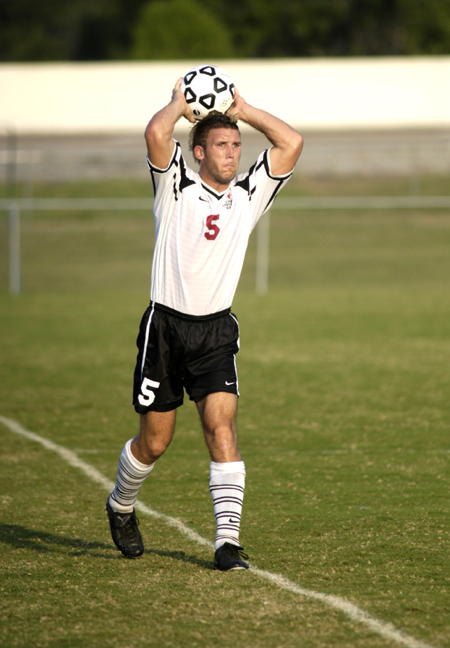 Sophmore defender Scott Sinclair throws the ball in to waiting teammates. - Photo by Kathleen Murray