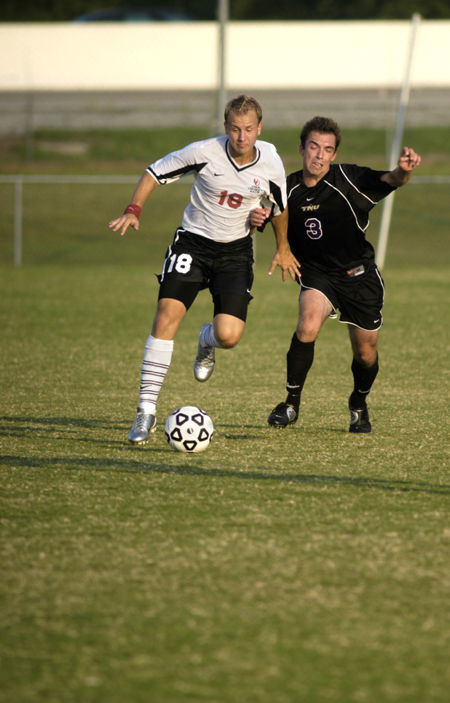 Chris Prentice (18), Union defender, dribbles past the competition. - Photo by Kathleen Murray