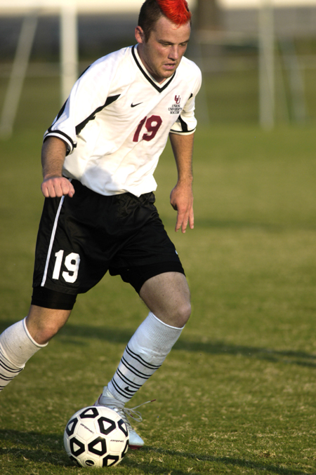 Gareth Munro works to advance the ball up the field during a match at Union. - Photo by Kathleen Murray