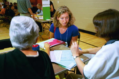 Freshman Lacy King talks with representatives from the Nursing department Tharon Kirk and Judy Dulberg at Freshman Pre-Registration in June. - Photo by Jim Veneman