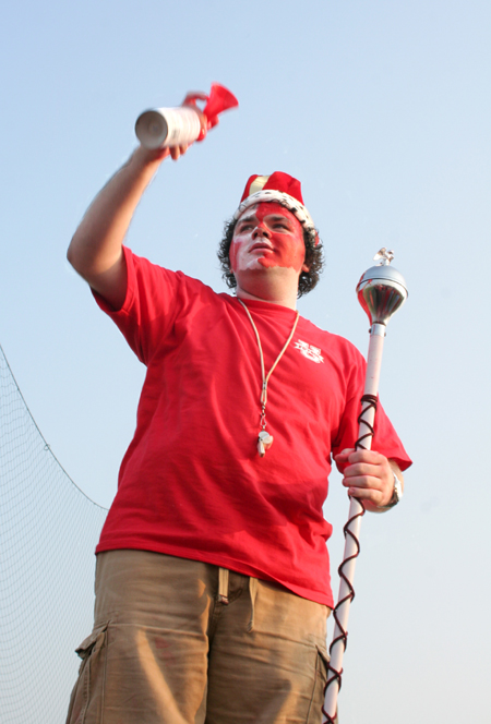 Josh Clarke, sophomore class president, sounds the horn during a pep rally before a Union soccer match. - Photo by Kyle Kurlick