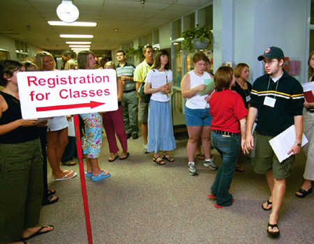 Freshman Nathaniel Webb exits the small gym where he has just finished registering for his Fall 2002 classes at Freshman Pre-Registration. - Photo by Jim Veneman