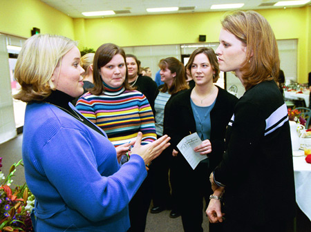 Heather Mercer speaks with Social Work majors Kelly Rogers, Melissa Norvell, and Allyson Clark after a luncheon following the chapel service. - Photo by Jim Veneman