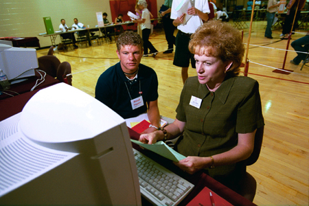 Freshman Brandt Waggoner completes his class schedule at Freshman Pre-Registration with assistance from Mrs. Linda Baker, administrative assistant to the Provost. - Photo by Jim Veneman