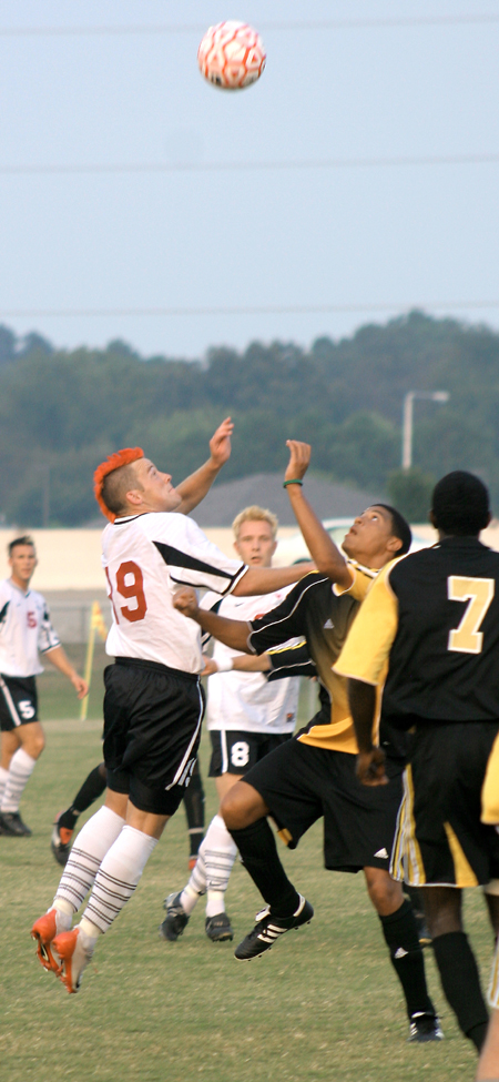Gareth Munro (19) skies to attempt to gain ball possession for his Bulldog teammates. - Photo by Kyle Kurlick