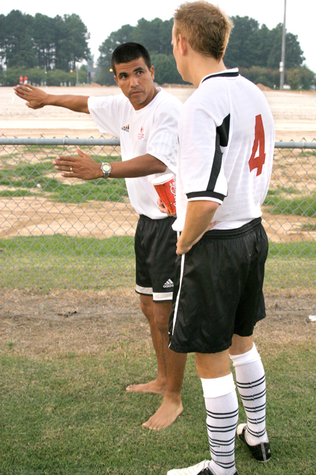 Union assistant, Clovis Simas, talks with Colin Bonner prior to a match at Union. - Photo by Kyle Kurlick