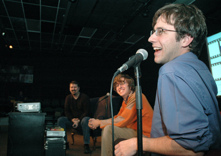 Kyle Rains (foreground) talks about the song he wrote that was used as the main track in Nic Pfost's (middle) Makeout Buddy film during the Union Student Film Festival Director's Talk.  - Photo by Brad Moore