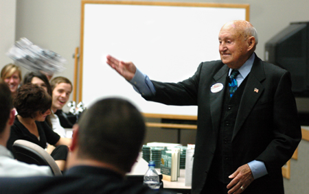 Chick-Fil-A founder Truett Cathy tosses out free Chick-Fil-A cows during his time with students in Harvey Hall. - Photo by Kristen Nicole Sayres