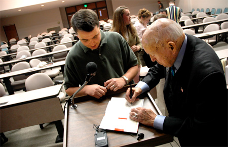 Steven Aldridge, sports information director, gets an autograph from Truett Cathy, founder of Chick-Fil-A. - Photo by Kristen Nicole Sayres