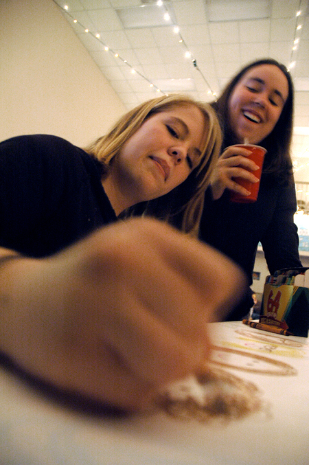 Juniors Candace Todd and Laura Dancy enjoy being able to color on the table during Mochafee, an annual student event in the McAfee commons. - Photo by Kristen Nicole Sayres