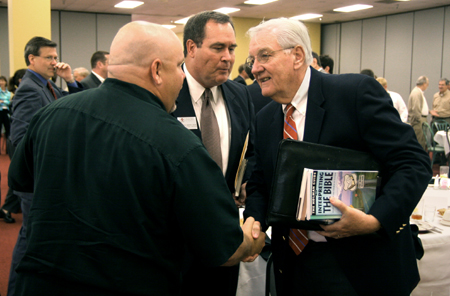 C. William Pollard, former chief executive officer of The ServiceMaster Company, greets an audience member at Union’s annual Business Through the Eyes of Faith luncheon. - Photo by Kyle Kurlick