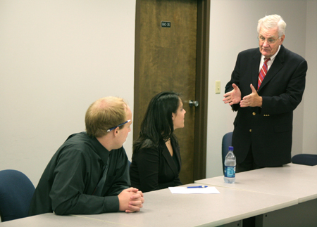 C. William Pollard, former chief executive officer of The ServiceMaster Company, spoke with Union students Nick Moser and Sarah Fellows after Union’s annual Business Through the Eyes of Faith luncheon. - Photo by Kyle Kurlick