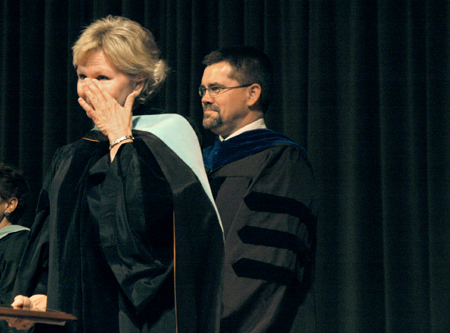 Pam Sutton wipes her eyes after just being named faculty member of the year during Awards Day.  Also pictured is Chris Hail, faculty member of the year 2004-2005. - Photo by Kyle Kurlick
