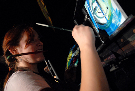 Cindy Keegan paints during an art interlude at Cafe Bongo. - Photo by Kristen Nicole Sayres