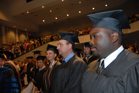 Graduates file into West Jackson Bapist Church for summer graduation. - Photo by Morris Abernathy