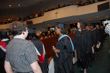 Graduates file into West Jackson Bapist Church for summer graduation. - Photo by Morris Abernathy