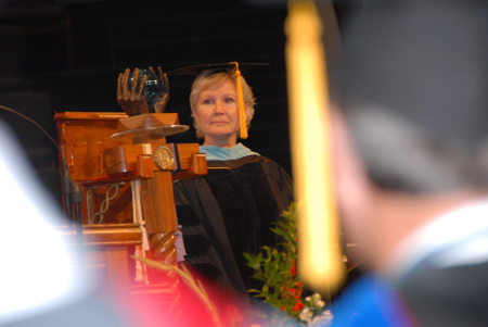 Pam Sutton, faculty member of the year, readies the mace during the processional at summer graduation. - Photo by Morris Abernathy