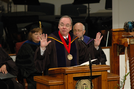 President Dockery welcomes the friends and families of the graduates during summer graduation. - Photo by Jim Veneman