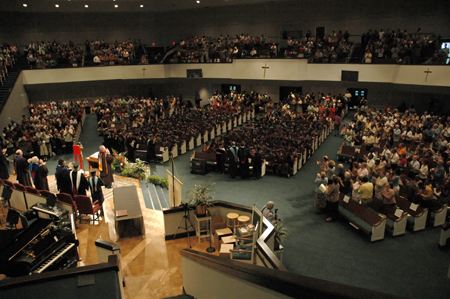 The crowd at summer graduation gave the graduates a standing ovation after the conferring of the degrees. - Photo by Jim Veneman