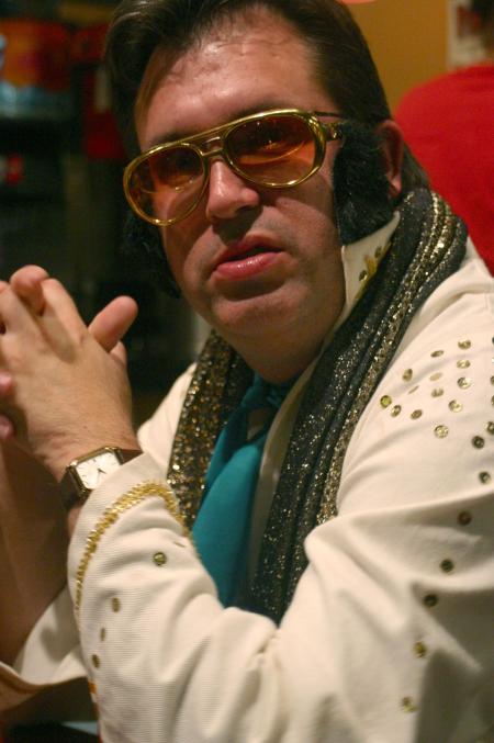 Gavin Richardson, associate professor of English, acts as an Elvis impersonator on a special night at Moe's where he belted out the song &ldquo;My Way.&rdquo; - Photo by Stephanie Schroeder