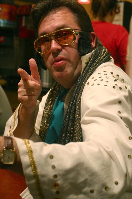 Gavin Richardson, associate professor of English, acts as an Elvis impersonator on a special night at Moe's where he belted out the song &ldquo;My Way.&rdquo; - Photo by Stephanie Schroeder
