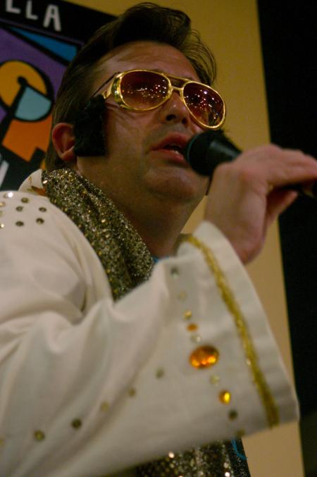 Gavin Richardson, associate professor of English, acts as an Elvis impersonator on a special night at Moe's where he belted out the song &ldquo;My Way.&rdquo; - Photo by Stephanie Schroeder