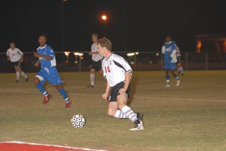 Benny Crozier drives the ball upfield against No. 1 ranked Lindsey Wilson College.  Union won 2-1 in overtime. - Photo by Morris Abernathy