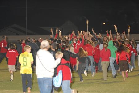 Fans rush the field after the men's soccer team's upset of the No. 1 ranked Lindsey Wilson team. - Photo by Morris Abernathy
