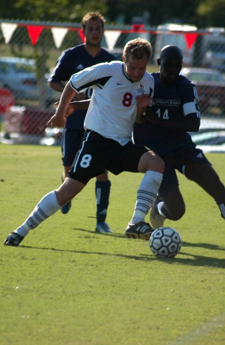 Bulldog defender Mark Forrest (8) steals the ball away from the Mid-Continent offense. - Photo by Steven Aldridge