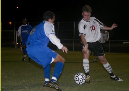 Junior Benny Crozier uses some fancy footwork against a Lindsey Wilson opponent. - Photo by Stephanie Schroeder