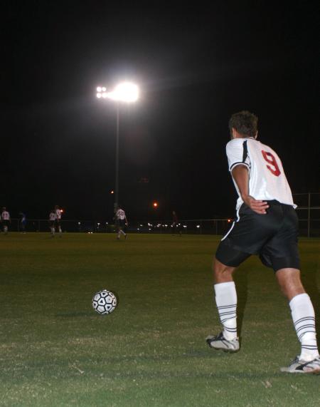 Sophomore Wagner Oliveira prepares to kick to ball back into play against Lindsey Wilson. - Photo by Stephanie Schroeder