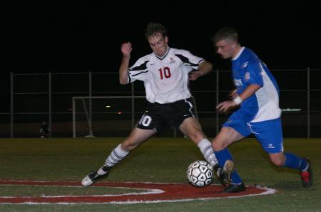Junior Benny Crozier makes a steal against a Lindsey Wilson opponent. - Photo by Stephanie Schroeder
