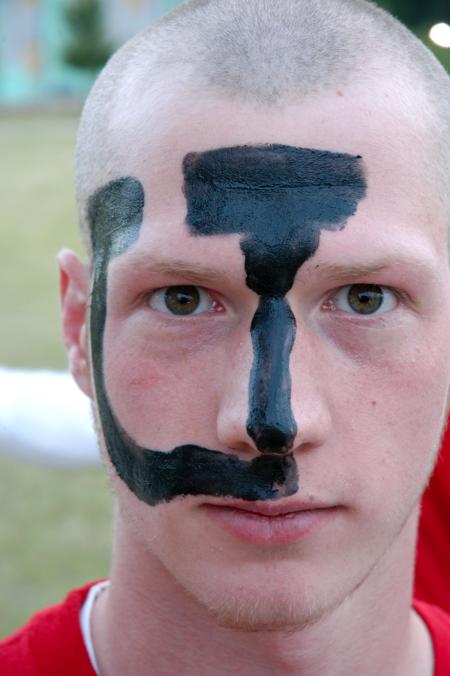 Mike Evans shows off his school spirit by getting a giant U painted on his face for the pep rally and march to the soccer game. - Photo by Kyle Kurlick