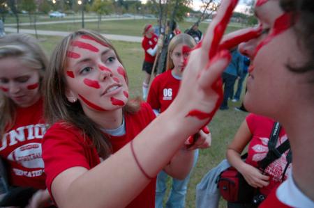 Noah Arnold gets his face painted moments before marching from Miller Tower to the soccer fields. - Photo by Kyle Kurlick