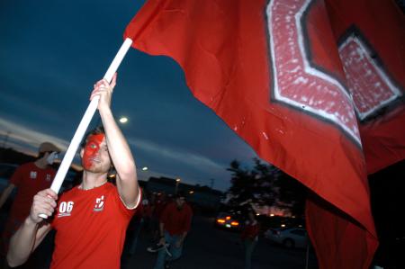 Ronald Long leads the march of Union fans from Miller Tower to the soccer fields for the game against Lindsey Wilson College. - Photo by Kyle Kurlick